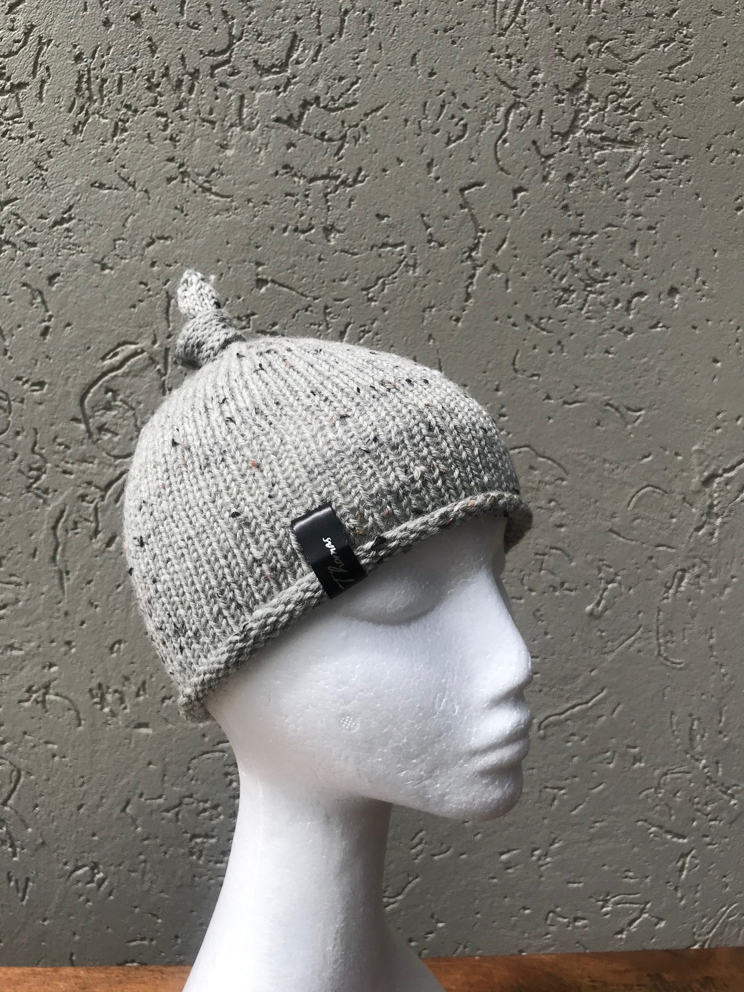 grey knitted baby hat
